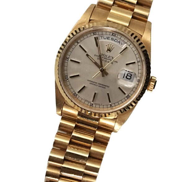 Diagonal view of Rolex Day-Date Quick President watches with pure 18k yellow gold